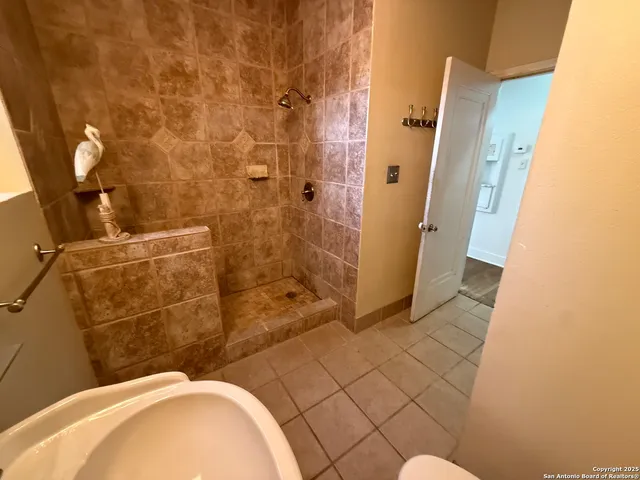 a bathroom with a sink and shower