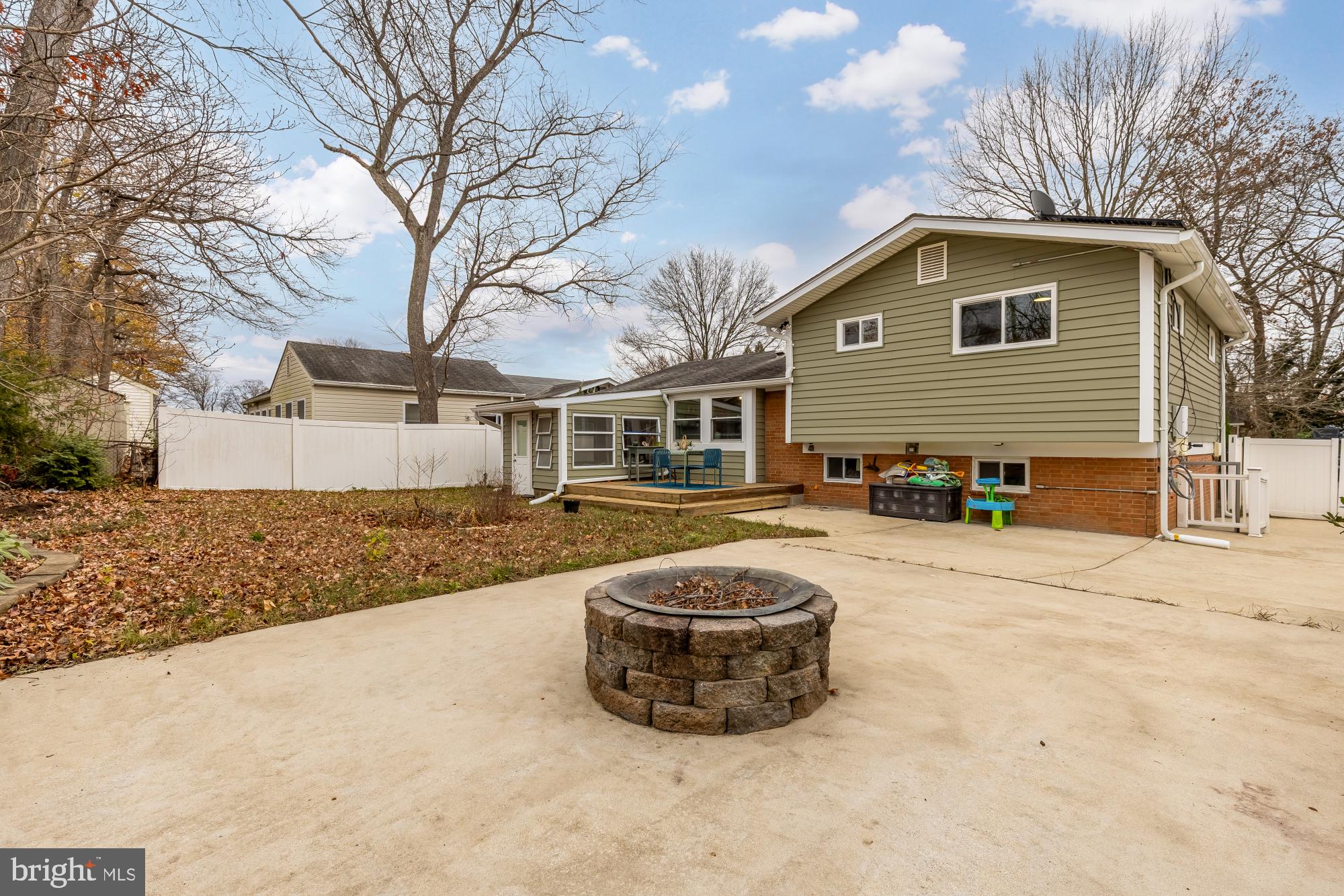 405 Irwin Street Silver Spring, MD 20901 - Photo 19 of 39 a front view of a house with a yard and garage