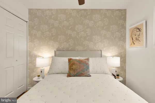 a spacious bathroom with a toilet and a shower