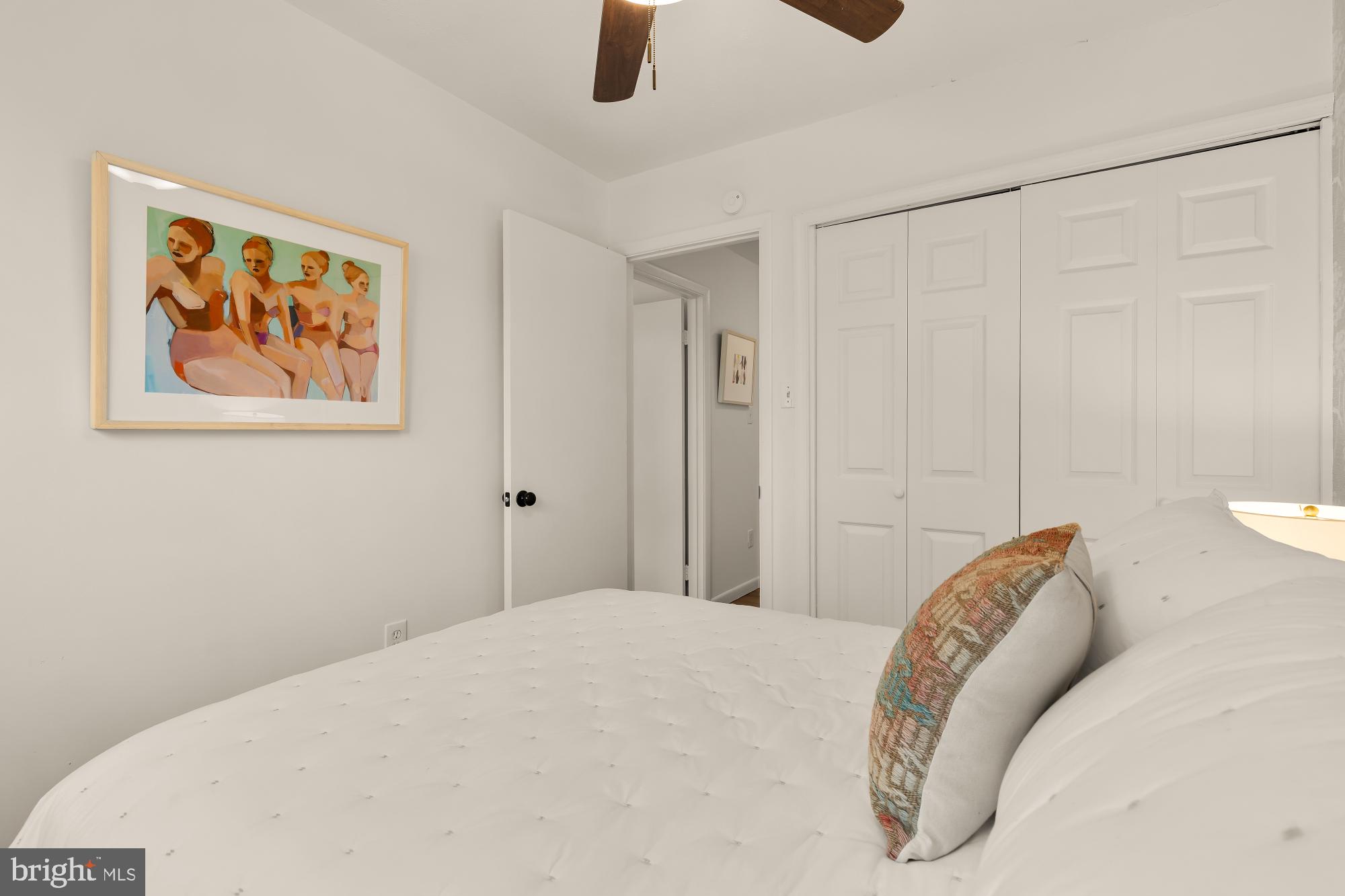 405 Irwin Street Silver Spring, MD 20901 - Photo 32 of 39 a bedroom with a bed and a painting on the wall