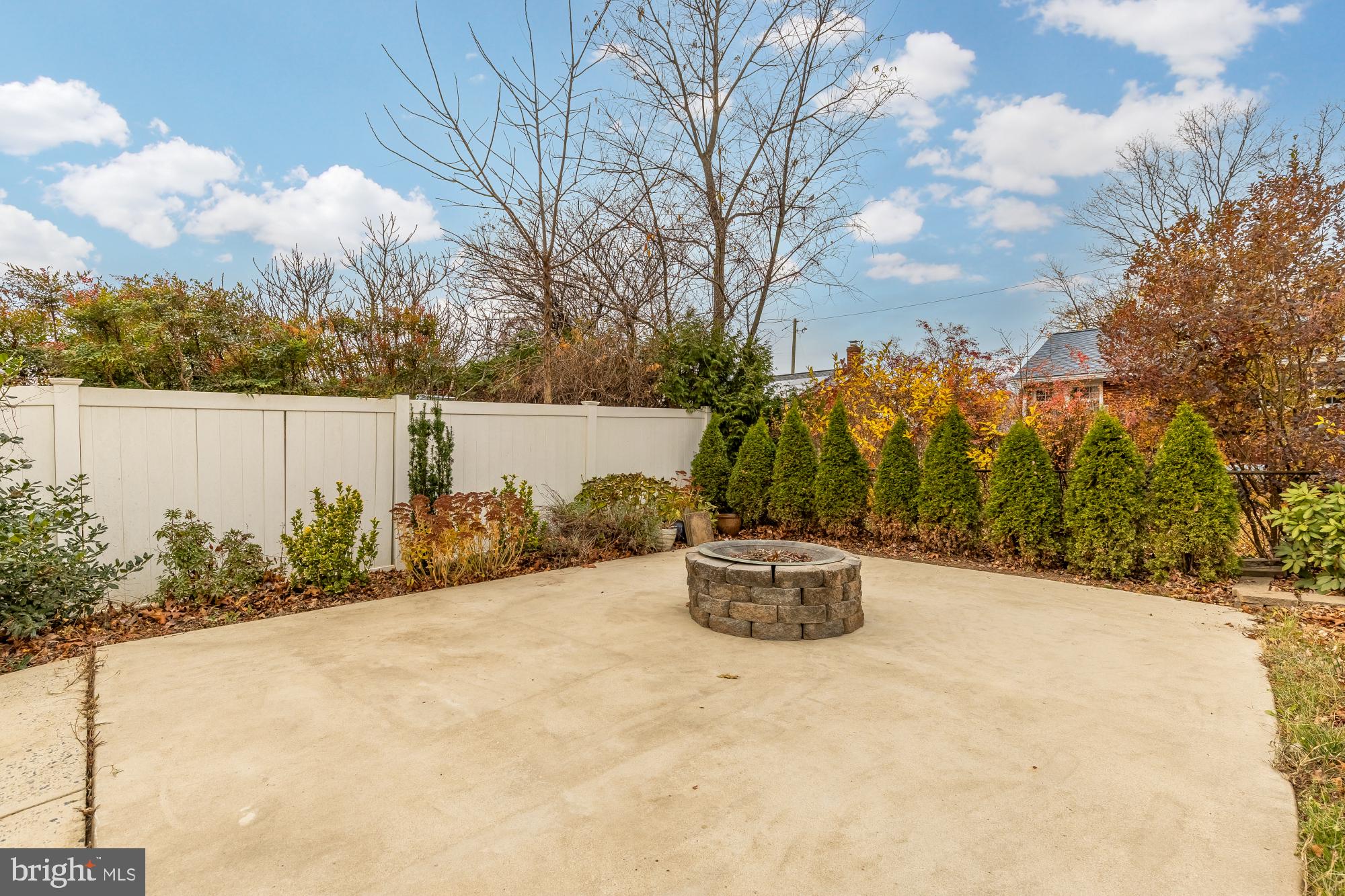 405 Irwin Street Silver Spring, MD 20901 - Photo 39 of 39 a view of a terrace with a bench and trees around