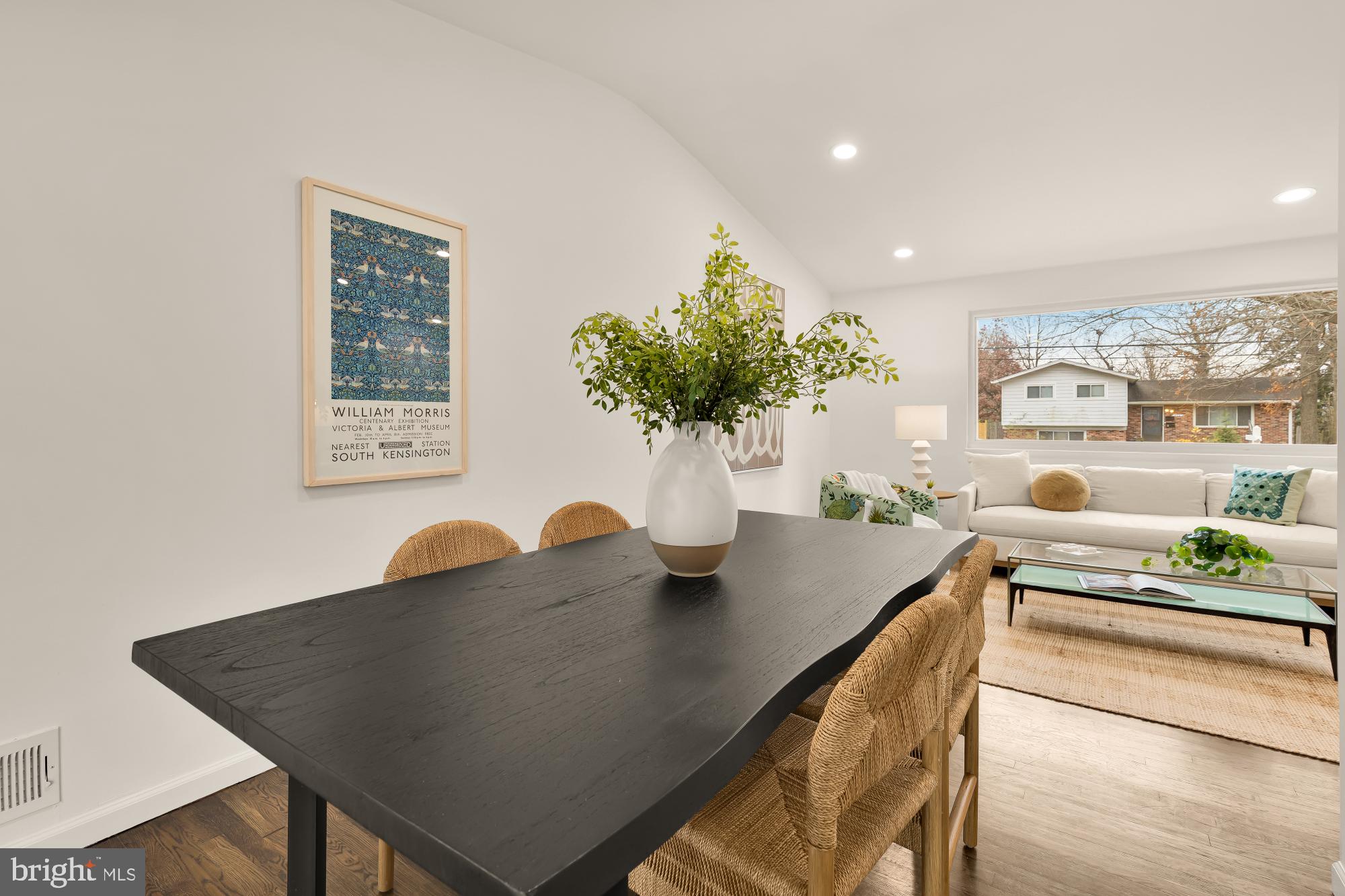405 Irwin Street Silver Spring, MD 20901 - Photo 7 of 39 a view of a dining room with furniture and a potted plant