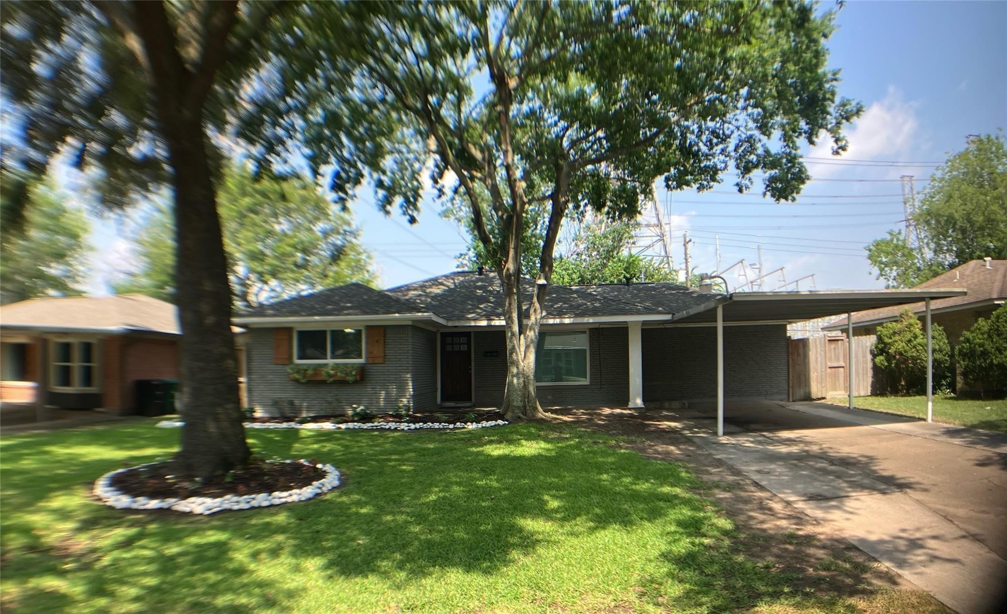 3027 Guese Road Houston, TX 77018 - Photo 1 of 22 Charming front exterior features mature trees, great curb appeal, and a welcoming residential setting.