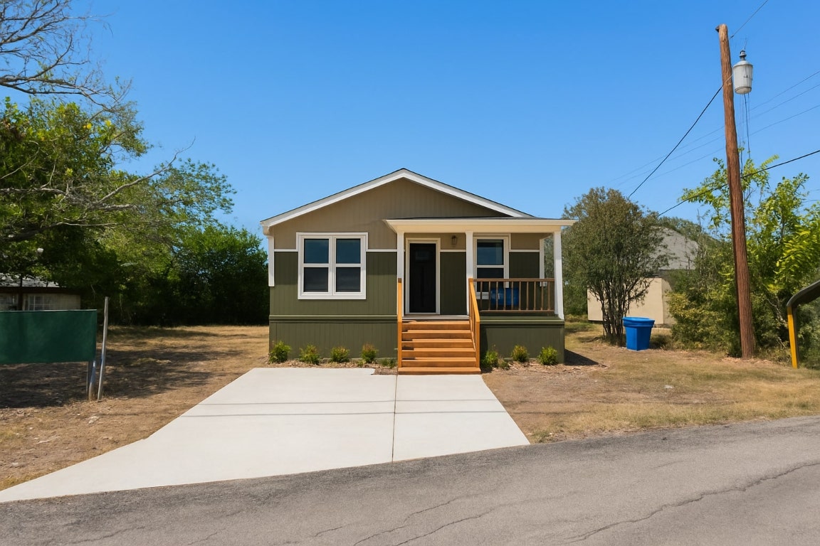112 2nd Avenue Taylor, TX 76574 - Photo 5 of 5 a front view of a house with a garden