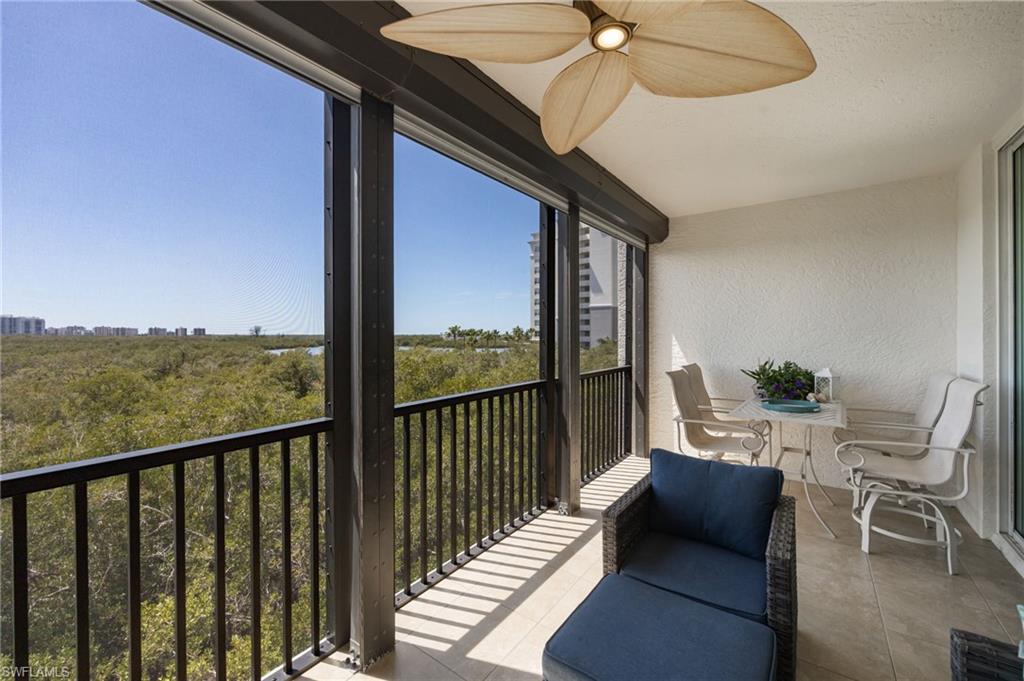 425 Cove Tower Drive, Unit 502 Naples, FL 34110 - Photo 15 of 18 a view of a balcony with furniture