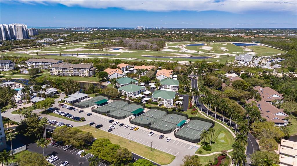 425 Cove Tower Drive, Unit 502 Naples, FL 34110 - Photo 18 of 18 a view of a city with an ocean