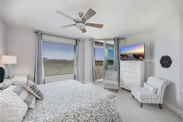 a bedroom with furniture and a window