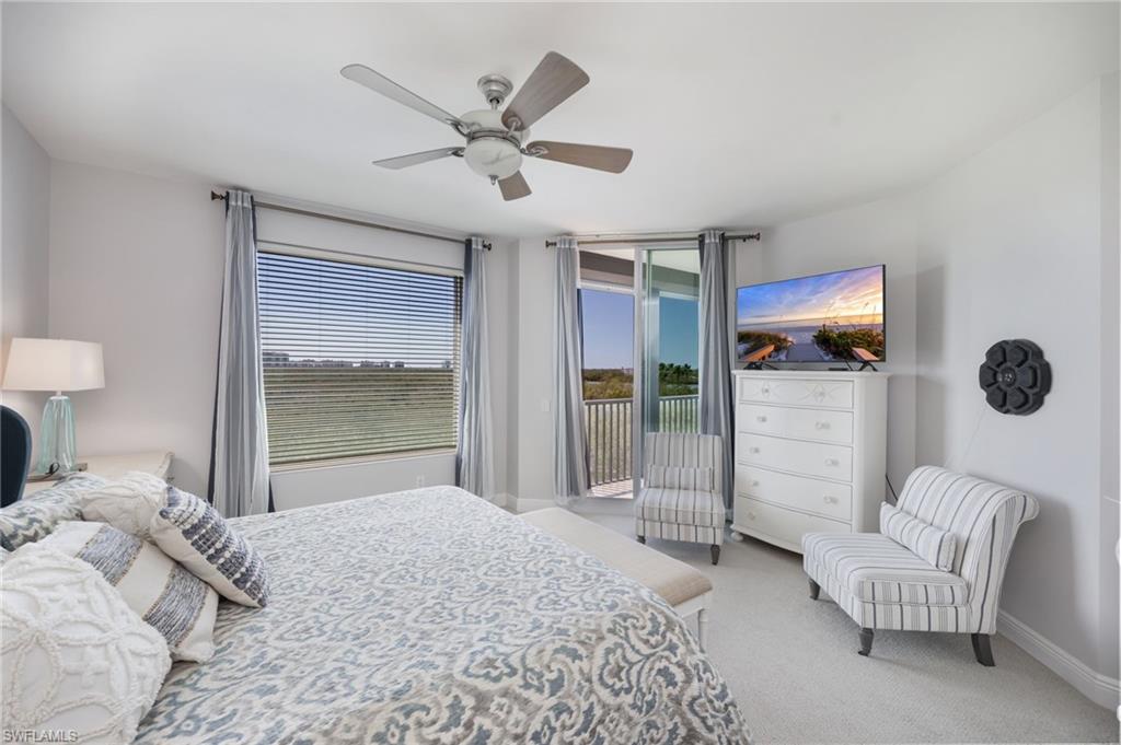 425 Cove Tower Drive, Unit 502 Naples, FL 34110 - Photo 9 of 18 a bedroom with furniture and a window