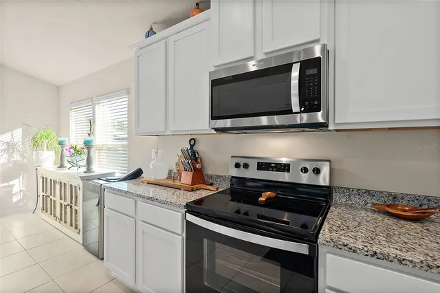 a kitchen with a stove and a microwave