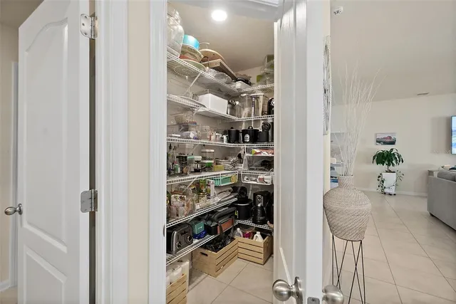 a kitchen with granite countertop a sink white cabinets and a dishwasher