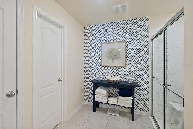 a bathroom with a sink toilet and a mirror