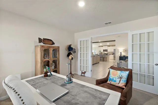 a view of a house with a backyard porch and sitting area