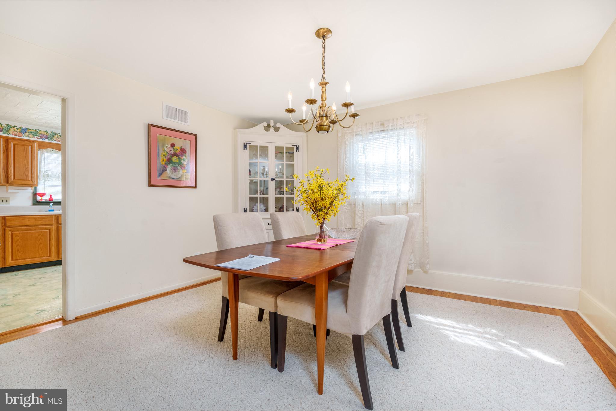 121 Devonshire Road Wilmington, DE 19803 - Photo 14 of 31 a view of a dining room with furniture and chandelier