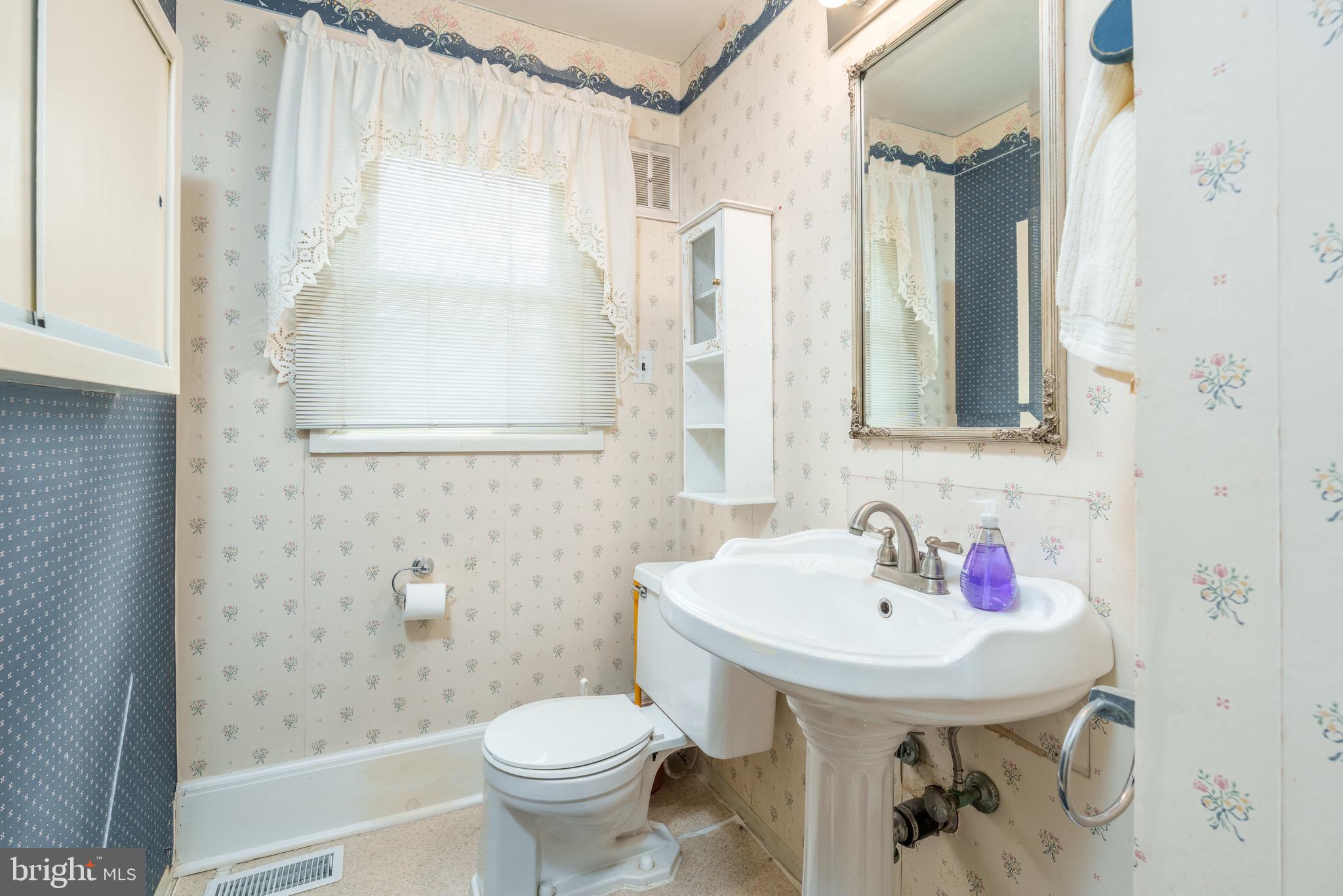 121 Devonshire Road Wilmington, DE 19803 - Photo 17 of 31 a bathroom with a sink toilet and shower