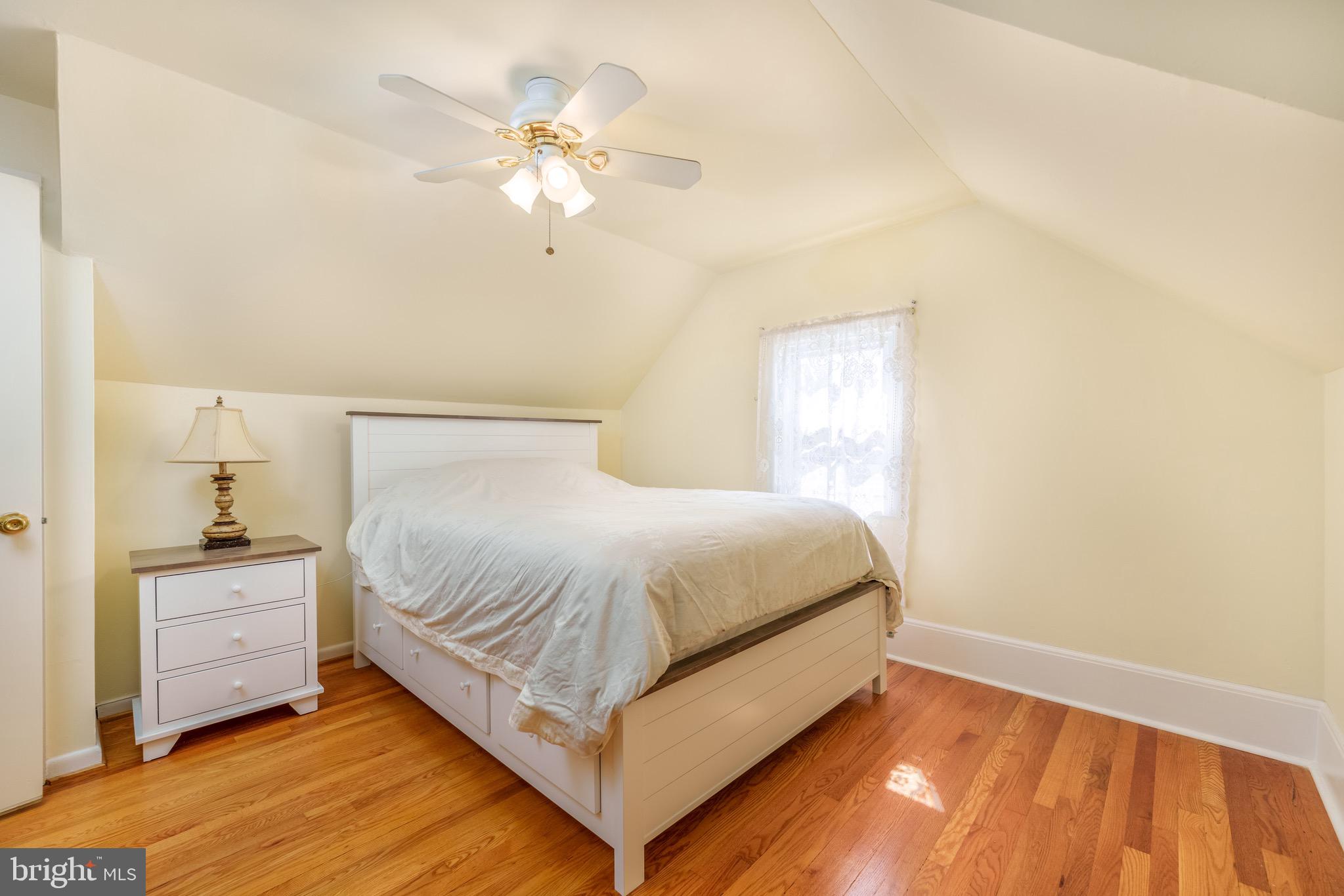 121 Devonshire Road Wilmington, DE 19803 - Photo 20 of 31 a bedroom with a bed and a chandelier