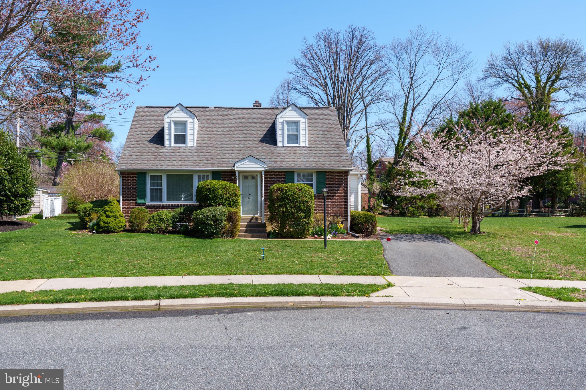 121 Devonshire Road Wilmington, DE 19803 - Photo 2 of 31 a front view of a house with a yard and garage