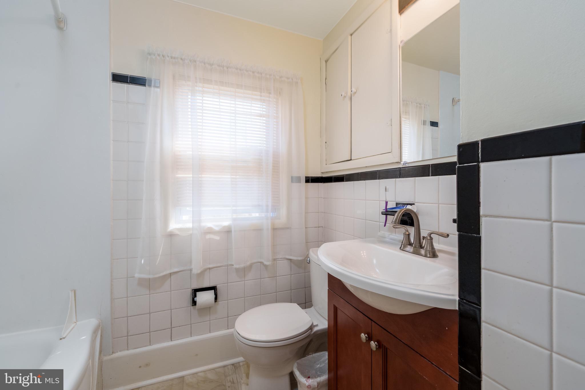 121 Devonshire Road Wilmington, DE 19803 - Photo 21 of 31 a bathroom with a sink toilet and shower