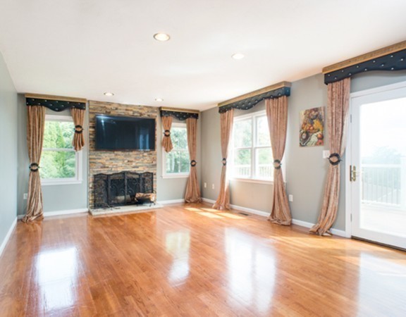 129 Raffaele Drive Waltham, MA 02452 - Photo 12 of 20 a view of a livingroom with a fireplace