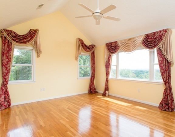 129 Raffaele Drive Waltham, MA 02452 - Photo 19 of 20 a view of a bedroom with a bed and a window