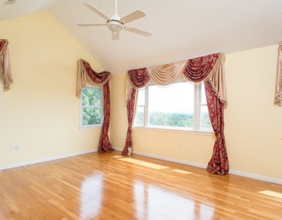 129 Raffaele Drive Waltham, MA 02452 - Photo 20 of 20 a view of a room with wooden floor and a window