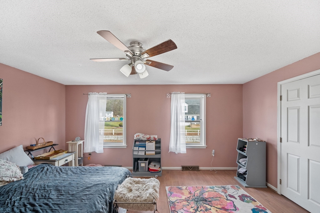 84 Century Way, Unit 84 Gardner, MA 01440 - Photo 19 of 42 a bedroom with furniture and a window