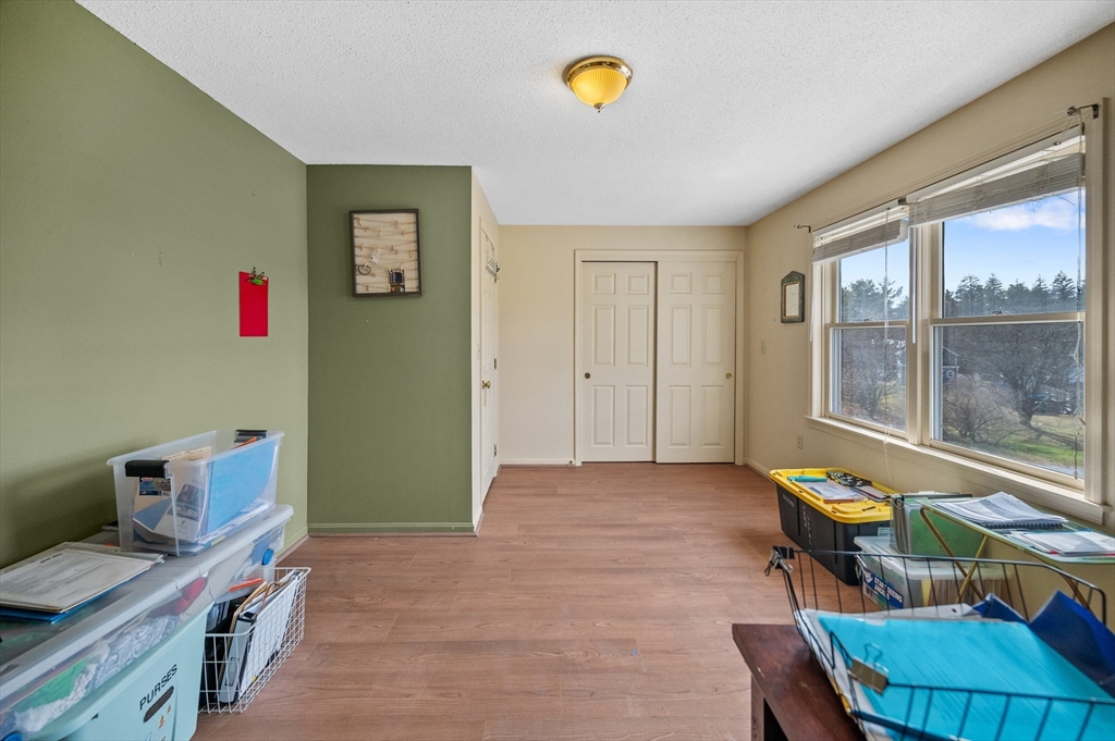 84 Century Way, Unit 84 Gardner, MA 01440 - Photo 25 of 42 a view of a workspace with furniture and a window