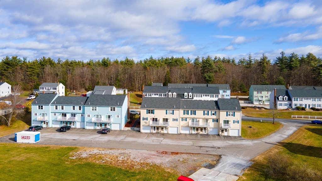 84 Century Way, Unit 84 Gardner, MA 01440 - Photo 37 of 42 a view of a town with swimming pool and mountains in the background