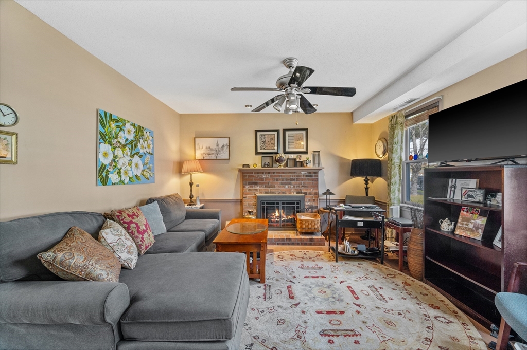 84 Century Way, Unit 84 Gardner, MA 01440 - Photo 7 of 42 a living room with furniture ceiling fan and a rug