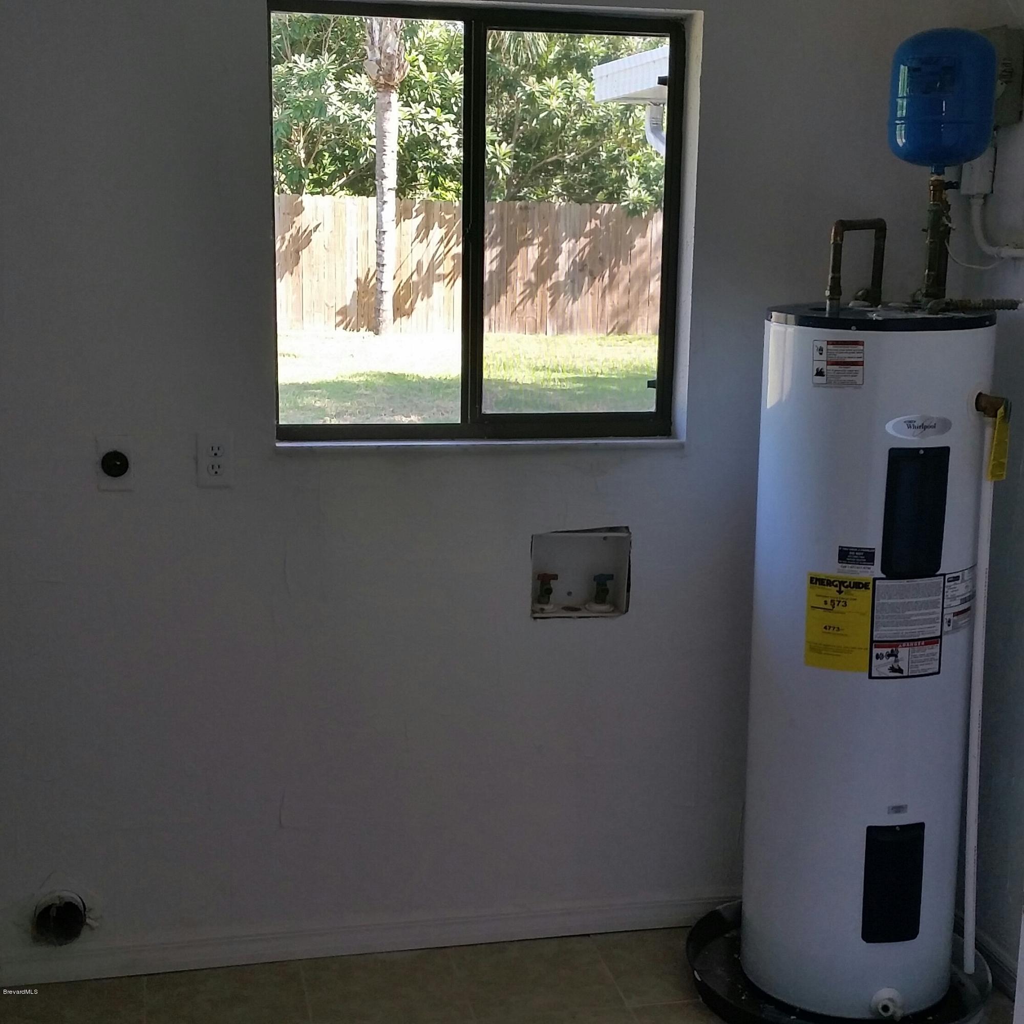 1031 Commerce Road Southeast Palm Bay, FL 32909 - Photo 11 of 13 Indoor Laundry Room