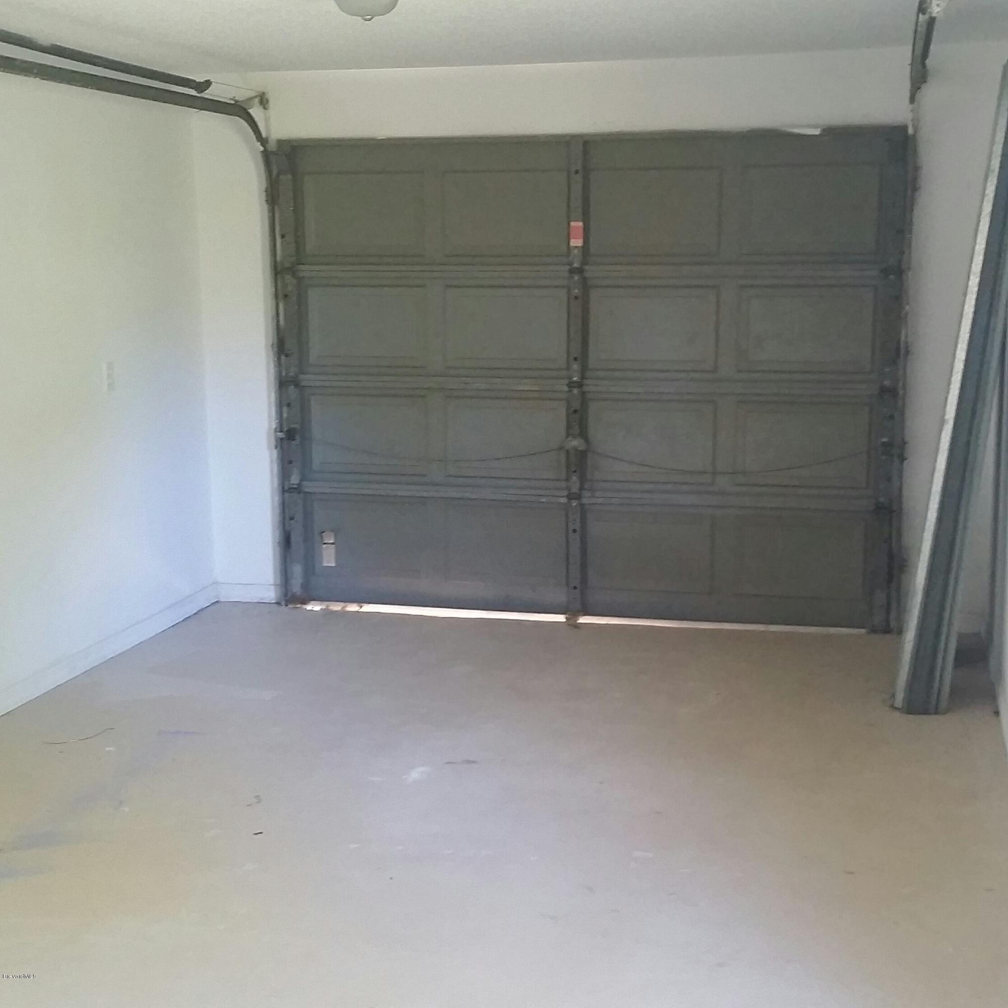 1031 Commerce Road Southeast Palm Bay, FL 32909 - Photo 12 of 13 Painted Garage Floor
