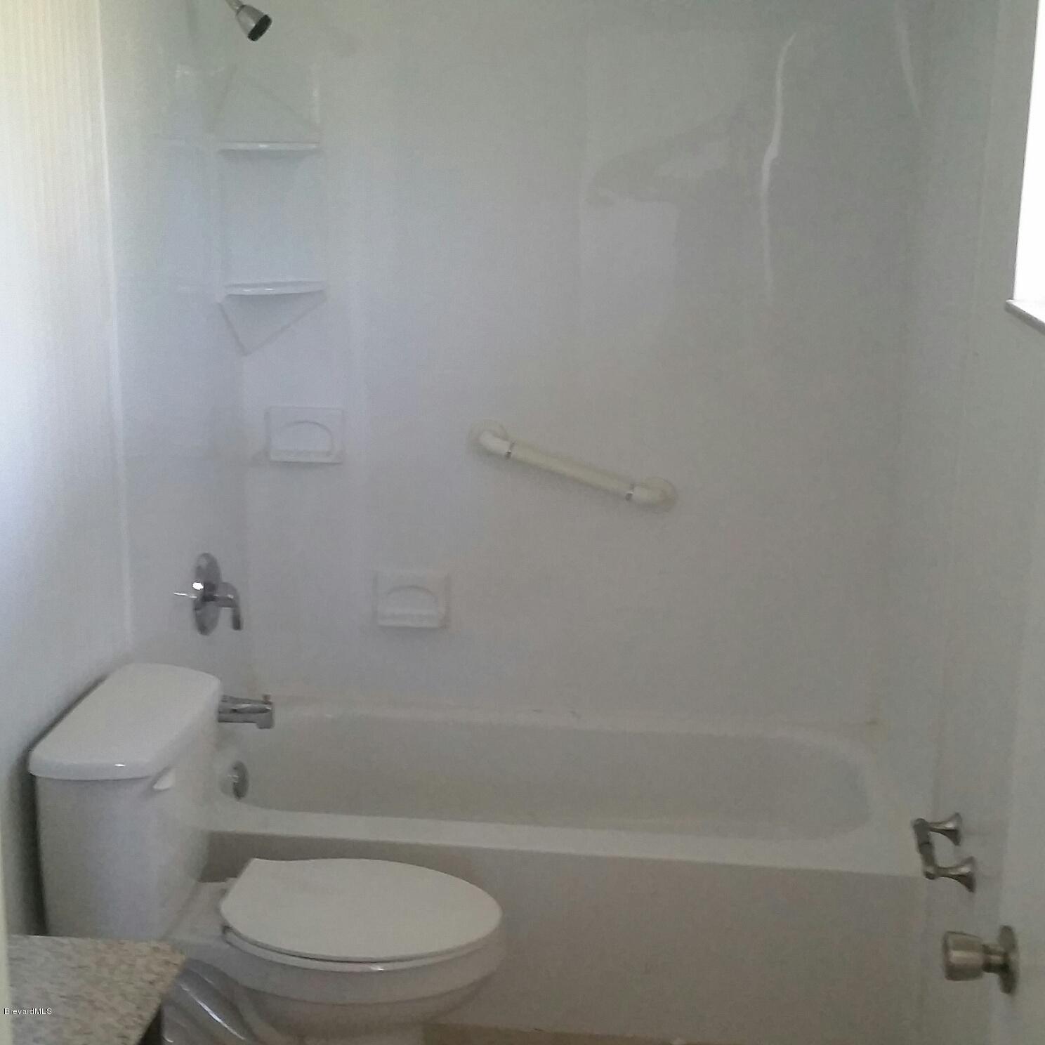 1031 Commerce Road Southeast Palm Bay, FL 32909 - Photo 10 of 13 Master Bathroom Bath/Shower