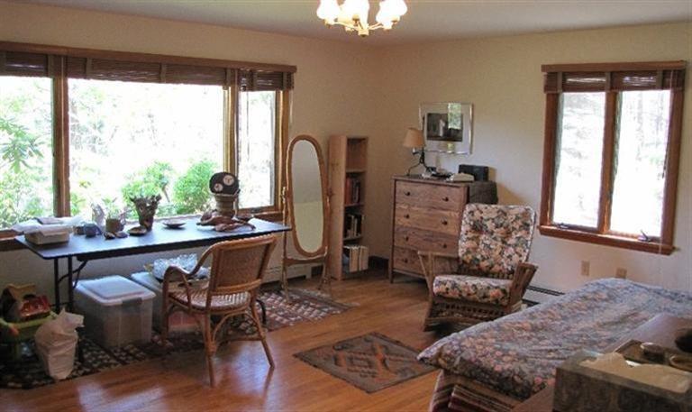 63 Old County Road Truro, MA 02666 - Photo 11 of 30 a living room with furniture and a large window