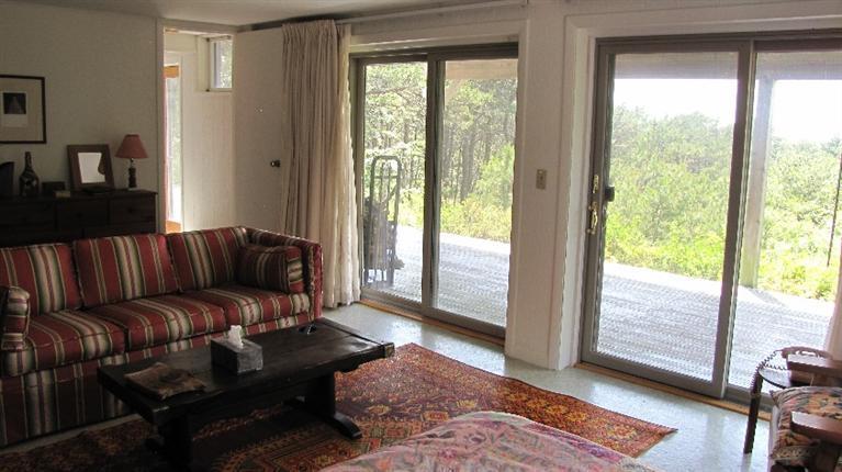 63 Old County Road Truro, MA 02666 - Photo 17 of 30 a living room with furniture and a window