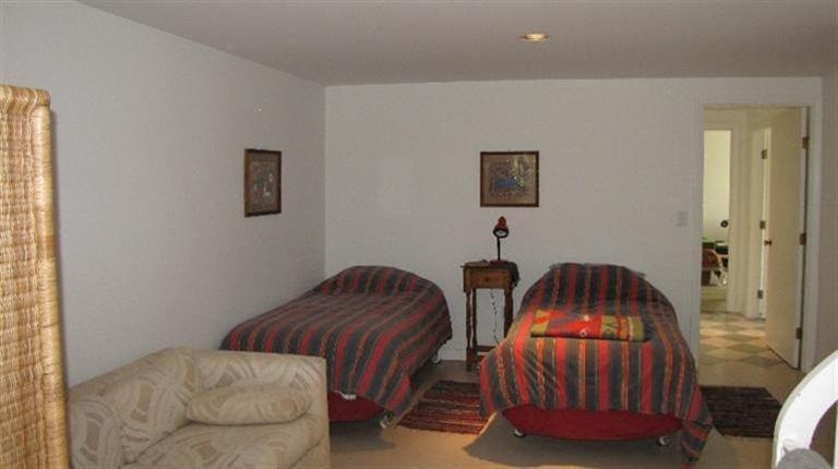 63 Old County Road Truro, MA 02666 - Photo 19 of 30 a bedroom with two beds and a lamp