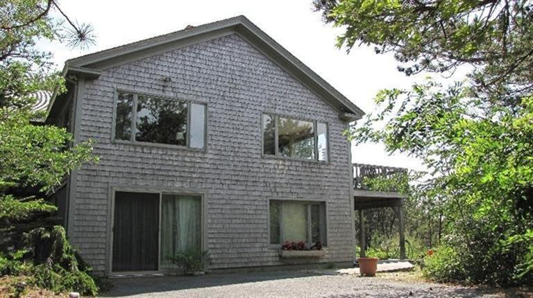 63 Old County Road Truro, MA 02666 - Photo 2 of 30 a front view of a house with a garage