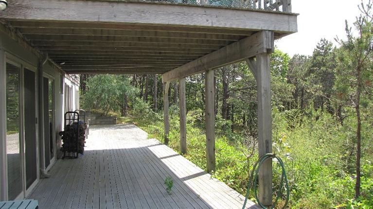 63 Old County Road Truro, MA 02666 - Photo 30 of 30 a porch with seating space and garden view