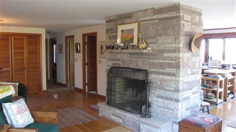 63 Old County Road Truro, MA 02666 - Photo 8 of 30 a living room with furniture and a fireplace