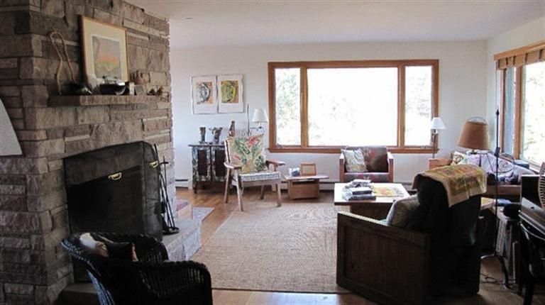 63 Old County Road Truro, MA 02666 - Photo 9 of 30 a living room with furniture and a fireplace