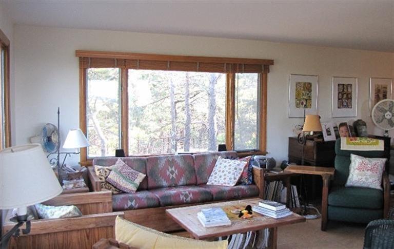 63 Old County Road Truro, MA 02666 - Photo 10 of 30 a living room with furniture and a large window