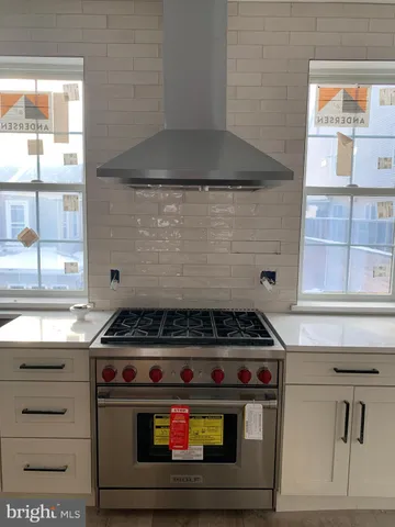 a living room with a couch and a window