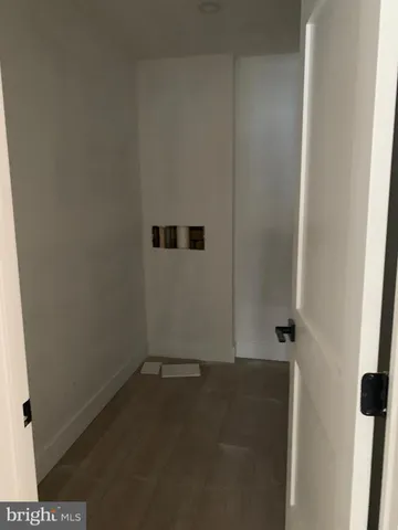 a bathroom with a toilet sink and shower