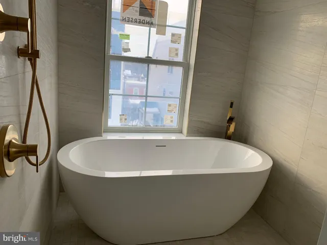 a view of a storage and utility room with cabinets