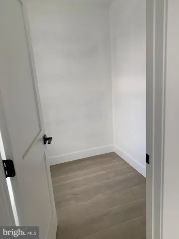 a stove top oven sitting inside of a kitchen