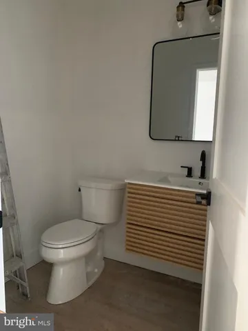 a bathroom with a toilet a sink and bathtub