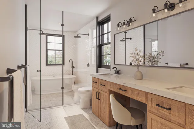 a bathroom with a toilet a sink and a mirror