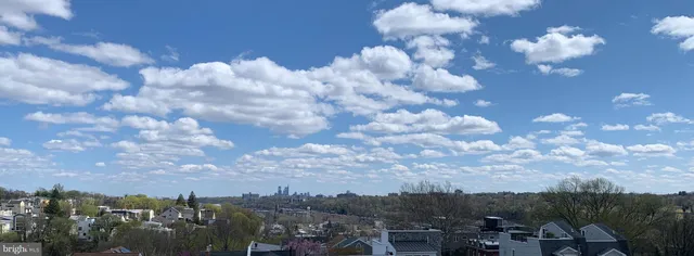 a kitchen with stainless steel appliances granite countertop a refrigerator a stove and a sink