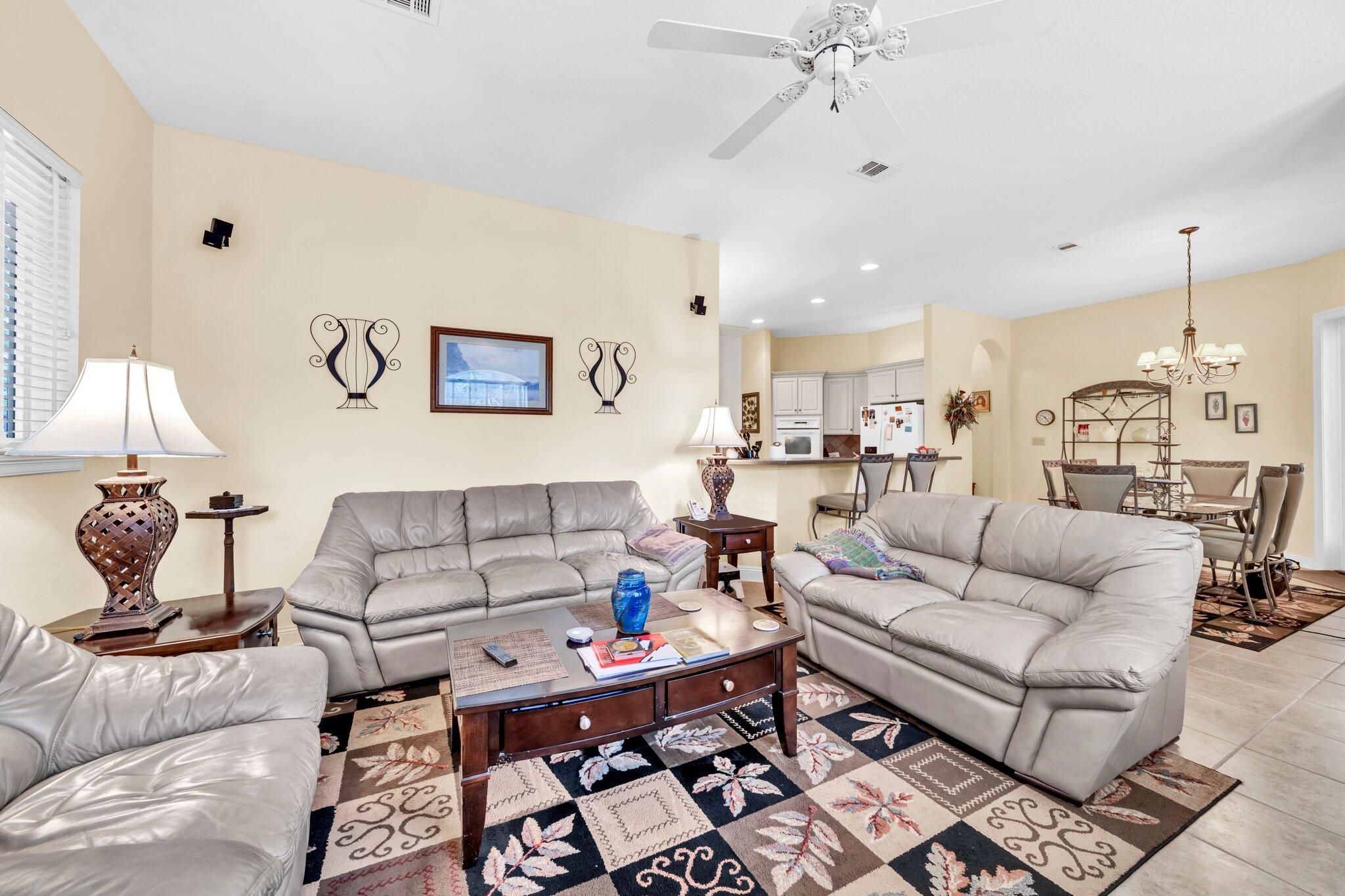 423 Maritime Court Destin, FL 32541 - Photo 12 of 39 a living room with furniture and a chandelier