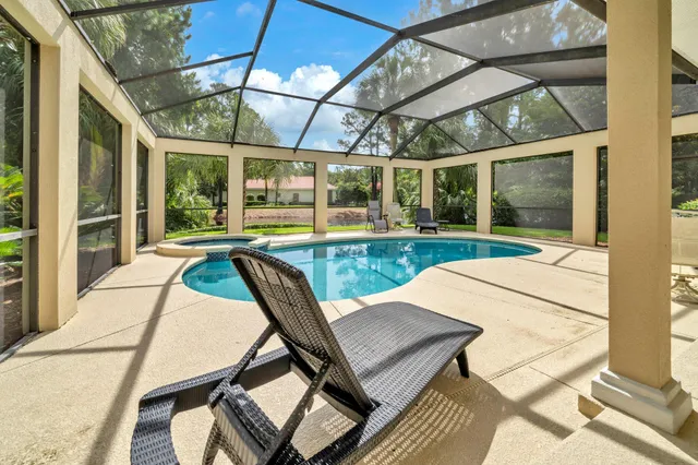 a view of a patio with a table and chairs