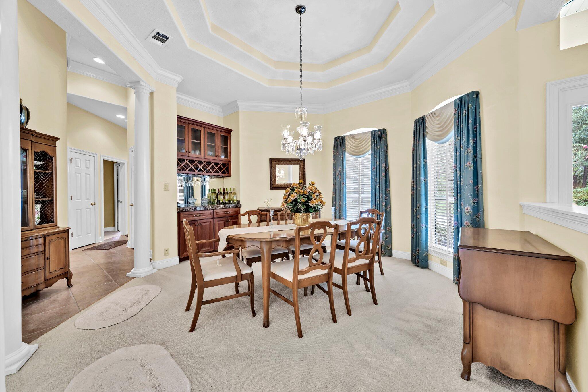 423 Maritime Court Destin, FL 32541 - Photo 14 of 39 a view of a dining room with furniture window and wooden floor