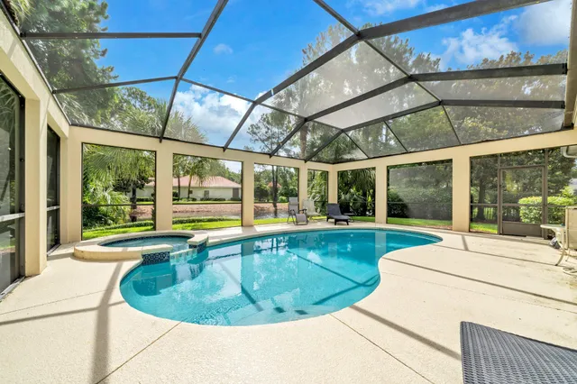 a view of a swimming pool with a patio
